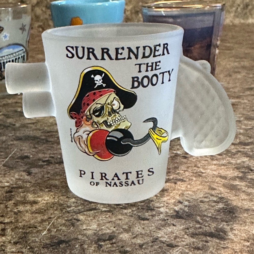 Five souvenir shot glasses